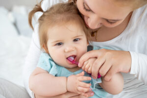 brush your child's teeth twice a day with fluoride toothpaste.